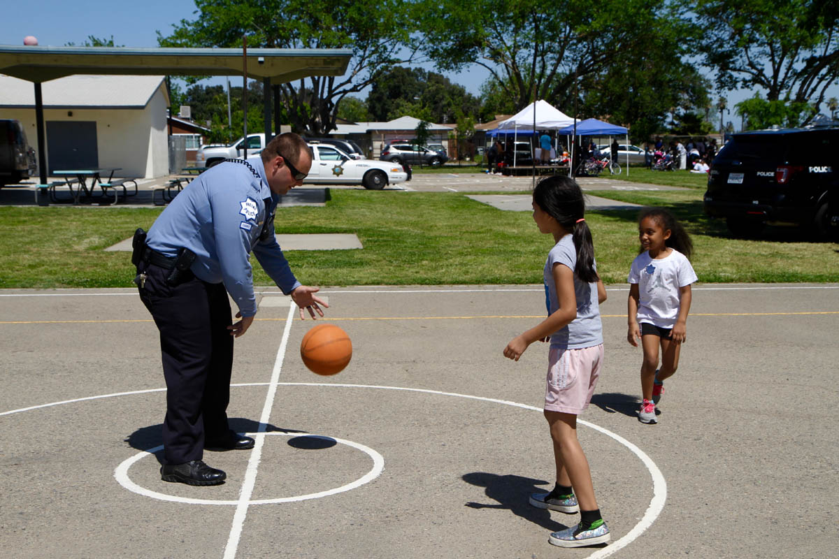 Officer playing with kids